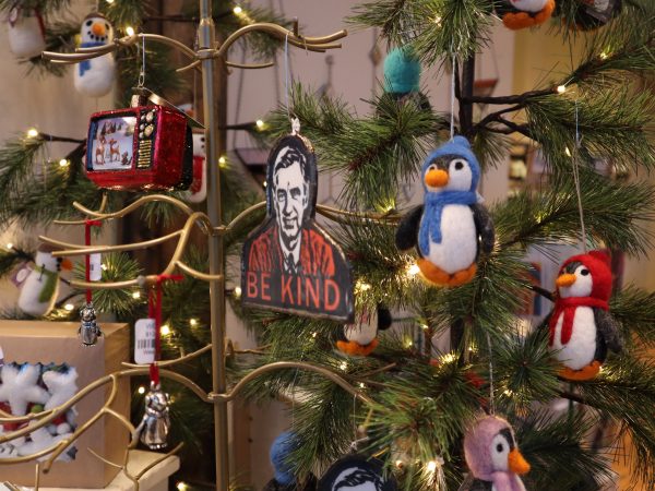 A christmas tree decorated with penguins and penguin ornaments.
